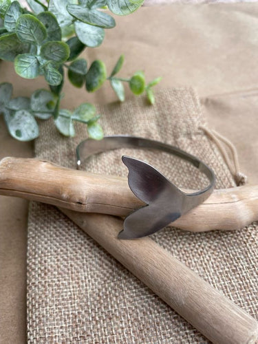 whale tail cuff on natural burlap background